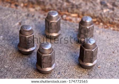 stock-photo-five-lug-nuts-from-a-car-sta