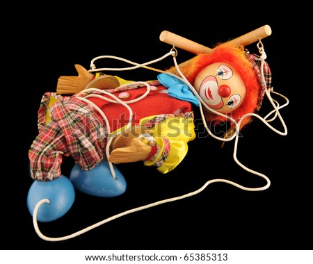 تأجير العقول Stock-photo-a-clown-marionette-collapsed-among-his-strings-isolated-on-black-65385313