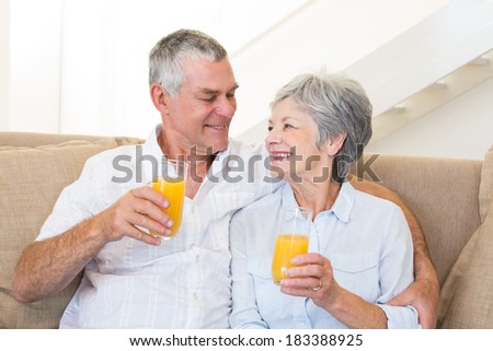stock-photo-senior-couple-sitting-on-cou