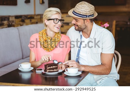 http://thumb7.shutterstock.com/display_pic_with_logo/76219/292949525/stock-photo-cute-couple-on-a-date-eating-a-piece-of-chocolate-cake-at-the-cafe-292949525.jpg