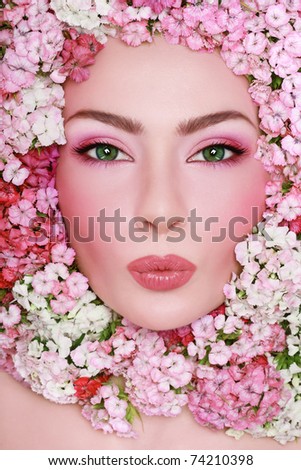 http://thumb7.shutterstock.com/display_pic_with_logo/78251/78251,1301430746,1/stock-photo-portrait-of-young-beautiful-fresh-girl-with-stylish-make-up-and-pink-flowers-around-her-face-74210398.jpg