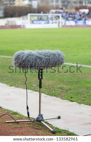 stock-photo-large-microphone-boom-for-tv-at-a-football-stadium-133582961.jpg