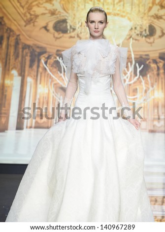  - stock-photo-barcelona-may-a-model-walks-on-the-yolan-cris-catwalk-during-the-barcelona-bridal-week-runway-140967289