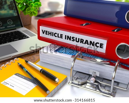 Red Ring Binder with Inscription Vehicle Insurance on Background of Red Ring Binder with Inscription Vehicle Insurance on Background of