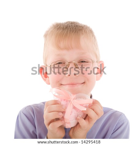 Portrait of smiling young boy take a gift in a nice pink heart shaped box isolated - stock-photo-portrait-of-smiling-young-boy-take-a-gift-in-a-nice-pink-heart-shaped-box-isolated-on-white-14295418