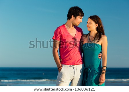 http://thumb7.shutterstock.com/display_pic_with_logo/84610/136036121/stock-photo-man-and-woman-couple-enjoying-the-romantic-sunset-on-a-beach-by-the-ocean-in-their-vacation-136036121.jpg