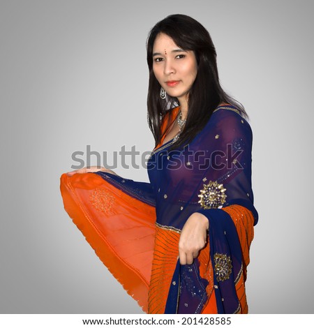 http://thumb7.shutterstock.com/display_pic_with_logo/849775/201428585/stock-photo-beautiful-asian-woman-in-indian-traditional-clothing-isolated-on-grey-background-201428585.jpg