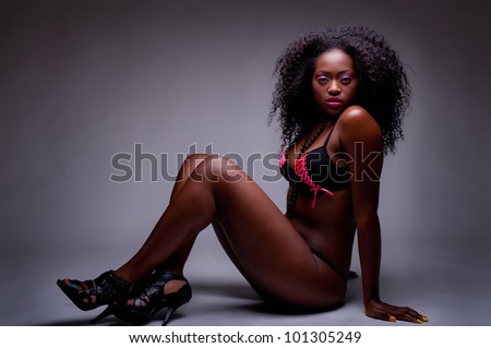 beautiful low key portrait of beautiful black woman in lingerie - stock photo
