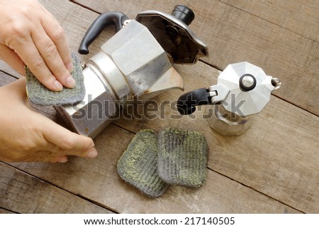 steel wool soap cleaning espresso coffee maker - stock photo