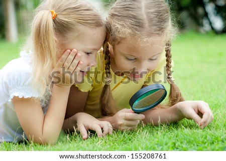 thumb7.shutterstock.com/display_pic_with_logo/907942/155208761/stock-photo-two-little-girls-with-magnifying-glass-outdoors-in-the-day-time-155208761.jpg