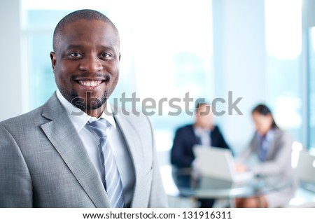 http://thumb7.shutterstock.com/display_pic_with_logo/91282/131916311/stock-photo-image-of-african-american-business-leader-looking-at-camera-in-working-environment-131916311.jpg