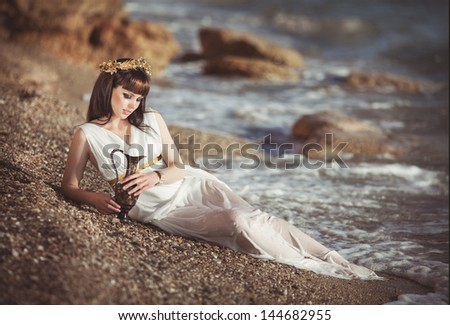 http://thumb7.shutterstock.com/display_pic_with_logo/913579/144682955/stock-photo-beautiful-woman-in-water-sea-beach-fantasy-mermaid-ocean-greek-goddess-bright-makeup-woman-girl-144682955.jpg
