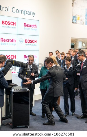  - stock-photo-hanover-germany-april-german-chancellor-angela-merkel-during-a-technology-showcase-tour-of-186276581