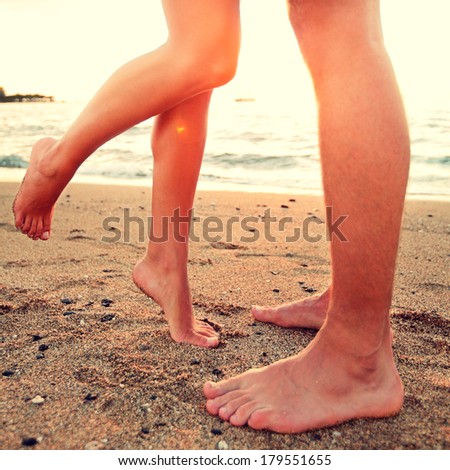 http://thumb7.shutterstock.com/display_pic_with_logo/97565/179551655/stock-photo-kissing-lovers-couple-on-beach-love-concept-showing-feet-in-close-up-woman-standing-on-toes-to-179551655.jpg