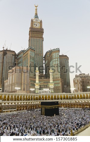 Skyline with Abraj Al Bait (Royal Clock Tower Makkah) (left) in Makkah, Saudi Arabia. The tower is the tallest clock tower in the world at 601m (1972 feet), built at a cost of USD1.5 billion.  - stock photo