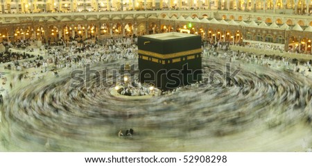 MAKKAH - APRIL 23 : A 5-second exposures of pilgrims circumabulate (tawaf) Kaaba on April 23, 2010 in Makkah, Saudi Arabia. Pilgrims circumambulate the Kaaba seven times in counterclockwise direction. - stock photo