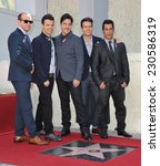 Small photo of LOS ANGELES, CA - OCTOBER 9, 2014: New Kids On The Block - Jordan Knight, Jonathan Knight, Donnie Wahlberg, Joey McIntyre & Danny Wood - at the unveiling of their star on the Hollywood Walk of Fame.