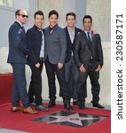 Small photo of LOS ANGELES, CA - OCTOBER 9, 2014: New Kids On The Block - Jordan Knight, Jonathan Knight, Donnie Wahlberg, Joey McIntyre & Danny Wood - at the unveiling of their star on the Hollywood Walk of Fame.