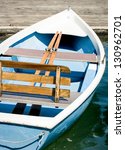old wooden rowboat at a lake