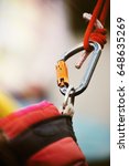 Small photo of Climbing sports image of a carabiner on a rope