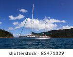 white sail yacht in coral sea...