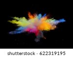 Small photo of Bizarre forms of powder paint and flour combined exploding in front of a black background to give off fantastic colors and forms.
