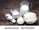 Small photo of fresh milk products on wooden background