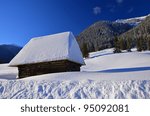 a mountain wooden hut covered...