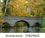 a stone bridge over a river in...