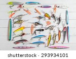 colorful fishing lures on wood...