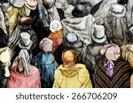 Small photo of At first glance it is a crowd of people, but in fact that is the wall of antique clothes - hats and overcoats
