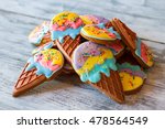 Small photo of Pile of colorful cookies. Glazed sweets on gray background. Biscuits from pastry shop. Make a break for dessert.