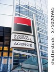 Small photo of PARIS, FRANCE - DEC 3, 2014: Societe Generale largest agency entrance in La Defense. Societe Generale is the 7th largest bank in Europe (Q4 2015)