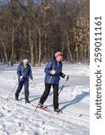 Small photo of UFA/BASHKORTOSTAN RUSSIA - 7th March 2015 - Two Russian cross country skiers exercising in the winter forest snow