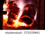 Small photo of Red and orange crackling fire from burning woods