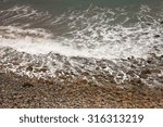 waves breaking into sponge bay  ...
