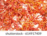Small photo of Dry pistils of saffron isolated on white. Food background. Closeup macro shot. Top view.