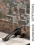 Small photo of Rajasthan, India - march 25, 2006: Old and small cannon on the outer walls of Mehrangarh fort on the outskirts of Jodhpur city