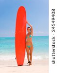 woman with red surfboard...