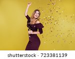 stock-photo-happy-new-year-to-you-one-young-and-beautiful-woman-dancing-with-glass-of-champagne-and-smiling-723381139.jpg