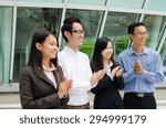 Small photo of Asian business team clap hands