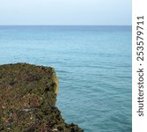 porous sharp rocky ocean cliff