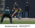 Small photo of PUCHONG, MALAYSIA - SEPT 24: Rakesh Madhavan (5), Malaysia bats against Guernsey at the Pepsi ICC World Cricket League Div 6 finals at the Kinrara Oval on September 24, 2011 in Puchong, Malaysia.