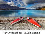 red kayaks at the lakeside ...