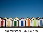 row of colorful beach hut  ...