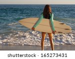 surfer girl on the beach  ...