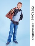 Small photo of Handsome young with carpetbag