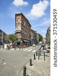 Small photo of BRUSSELS, BELGIUM - JULY 17, 2014: The old street with the scenic houses, Square du Chatelain in Ixelles is a good place for lunch on July 17 in Brussels.