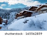 ski resort with winter chalets  ...