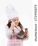 Small photo of A young girl enjoys mixing up something good to eat.